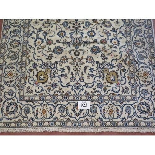 923 - A Persian Yazd carpet, cream ground detailed with foliage and in very good condition. 252 x 150.