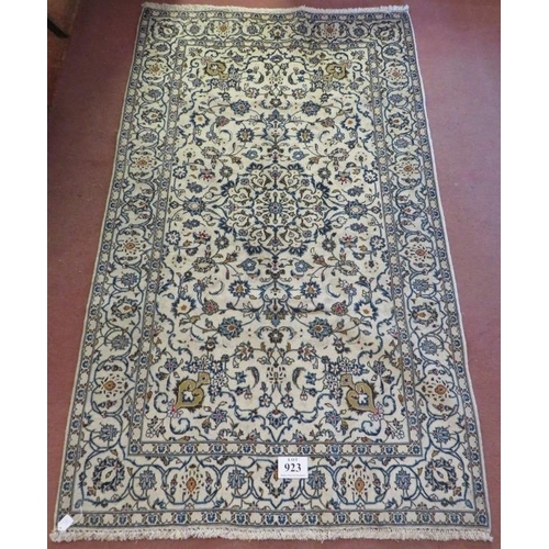 923 - A Persian Yazd carpet, cream ground detailed with foliage and in very good condition. 252 x 150.