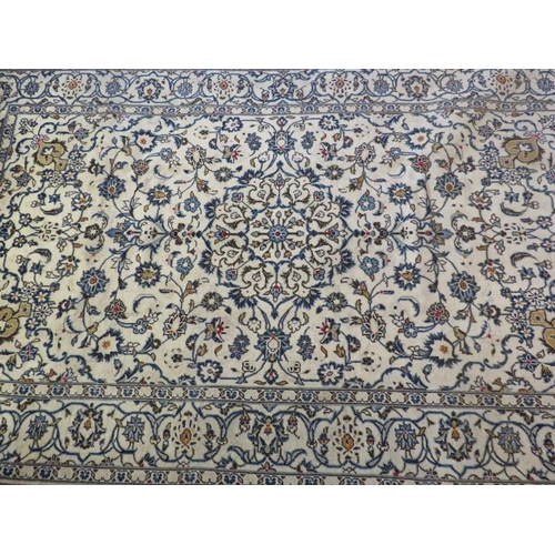 923 - A Persian Yazd carpet, cream ground detailed with foliage and in very good condition. 252 x 150.