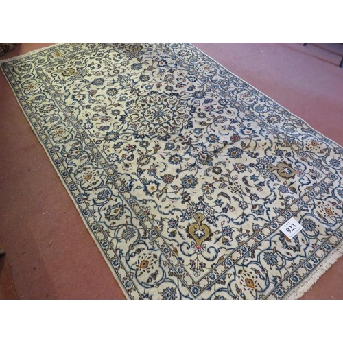 923 - A Persian Yazd carpet, cream ground detailed with foliage and in very good condition. 252 x 150.