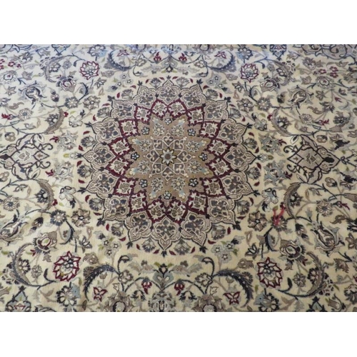 925 - A Fine Persian Naim carpet, a central spirograph pattern on good ground with heavy foliage design. 3... 