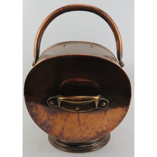 129 - A copper coal scuttle and shovel, late 19th/early 20th century. (2 items) Coal Scuttle: 18 in (46 cm... 