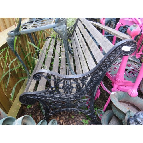 893 - A vintage wrought iron scroll back garden bench with pierced end supports and teak slatted seat.
Hei... 