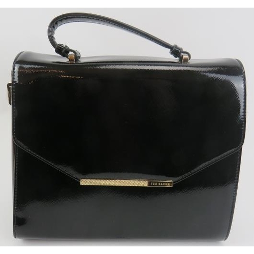 488 - A Ted Baker black patent handbag with gold coloured trim, with dust bag.
Provenance: Part of a priva... 