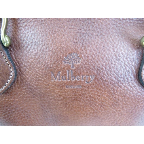 489 - A Mulberry tan leather handbag with original Mulberry plaid lining.
Provenance: Part of a private co... 