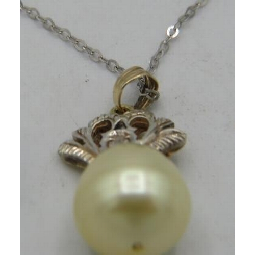 430 - A South Sea pearl & diamond pendant, pearl approx 10mm across. Indistinct marks on bail, on a fine 1... 