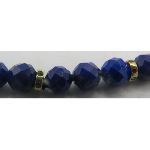 470 - A fine AAAA quality faceted cut lapis lazuli necklace with 14ct yellow gold ball clasp set with emer... 