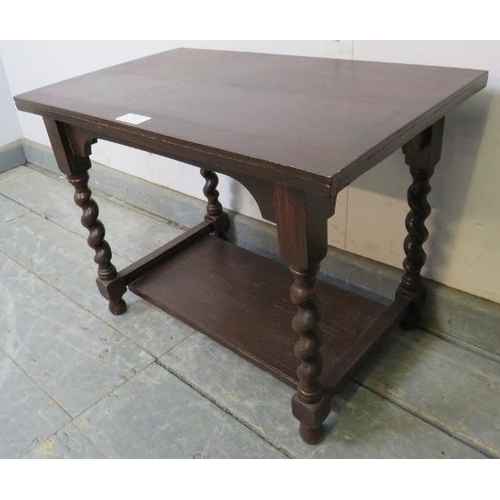 852 - A small 1920s oak rectangular two-tier side table, on barley twist supports. 
H39cm W53cm D32cm (app... 