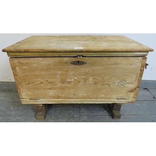 866 - An antique stripped pine flat top trunk with fall front, on rail supports with parquetry inlay. 
H45... 