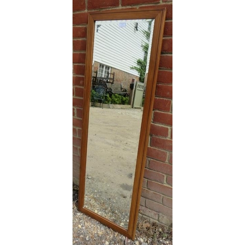 878 - An Arts & Crafts satin walnut rectangular bevelled wall mirror, strung with ebony and parquetry inla... 