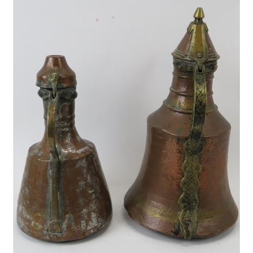 222 - Two Middle Eastern metalwork decanters. Comprising a copper jug of mallet form with hinged cover tog... 