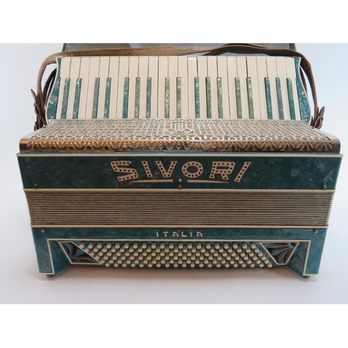 100 - An Italian Sivori piano accordion. Modelled with one hundred and twenty buttons and 41 keys. Travell... 