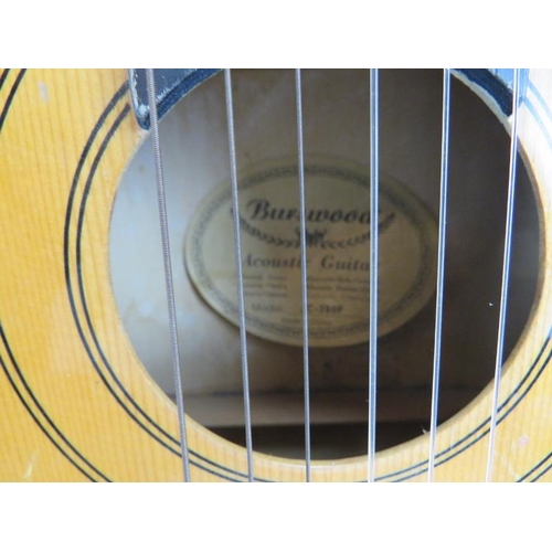 106 - A Burswood Acoustic Guitar, 20th century.  Carry case included. 38.8 in (98.5 cm) length. 
Condition... 