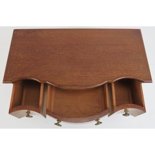 113 - A miniature mahogany dressing table apprentice piece, 20th century. With three working draws to be u... 