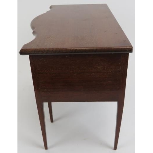 113 - A miniature mahogany dressing table apprentice piece, 20th century. With three working draws to be u... 