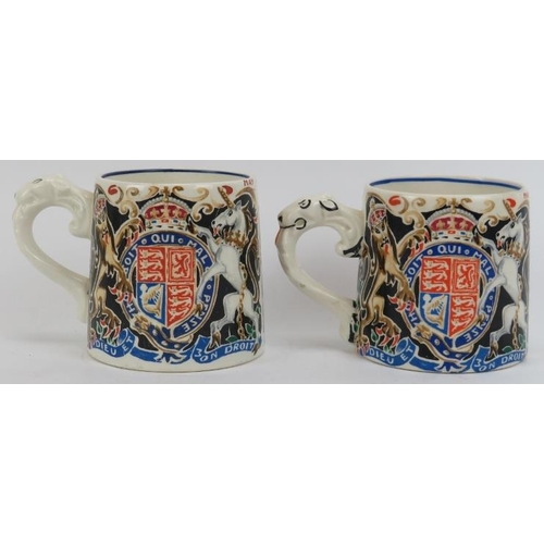 145 - Two Royal Memorabilia Coronation mugs designed and modelled by Dame Laura Knight DBE RA. Comprising ... 