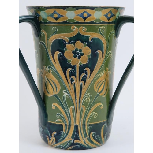 149 - A William Moorcroft Macintyre green and gold Florian Ware three handled vase, circa 1903. Tubeline d... 