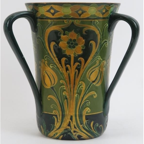 149 - A William Moorcroft Macintyre green and gold Florian Ware three handled vase, circa 1903. Tubeline d... 