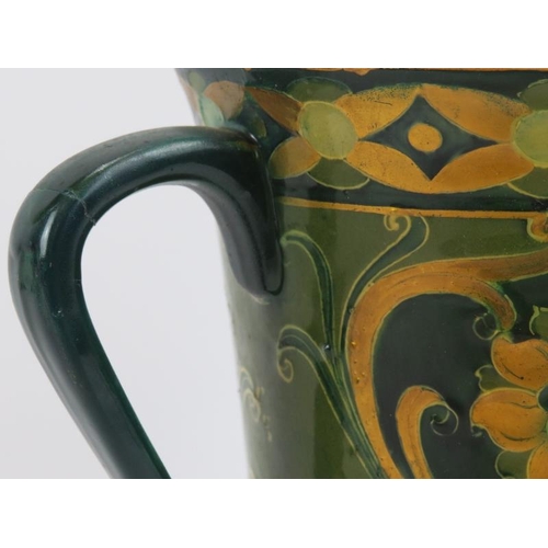 149 - A William Moorcroft Macintyre green and gold Florian Ware three handled vase, circa 1903. Tubeline d... 