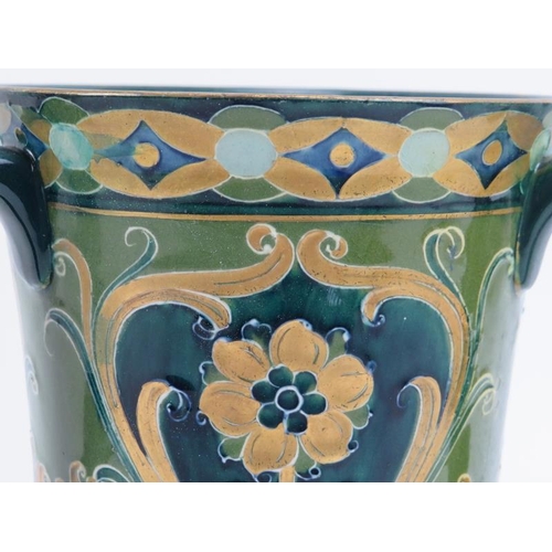 149 - A William Moorcroft Macintyre green and gold Florian Ware three handled vase, circa 1903. Tubeline d... 