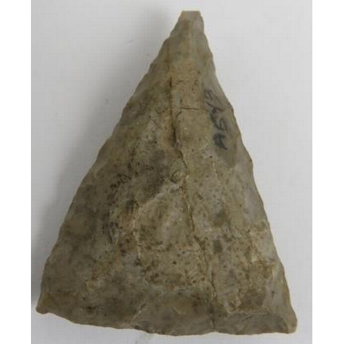 160 - A Neolithic Stone Age stone spearhead and five arrow heads. Indistinct later written English inscrip... 