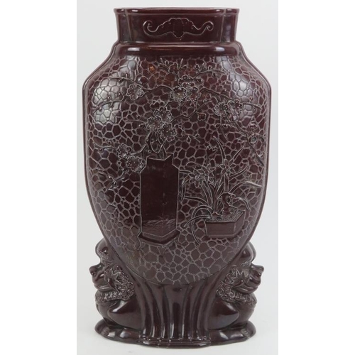 163 - A Chinese sang de boeuf glazed vase, 20th century. Of compressed form with decoration moulded in rel... 