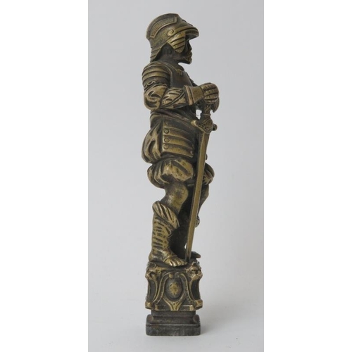 174 - A large brass and wrought iron heraldic wax seal. Modelled in the form of a European knight in armou... 