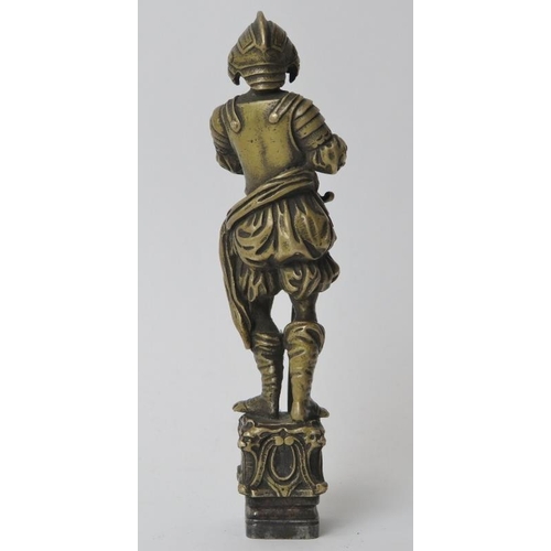 174 - A large brass and wrought iron heraldic wax seal. Modelled in the form of a European knight in armou... 