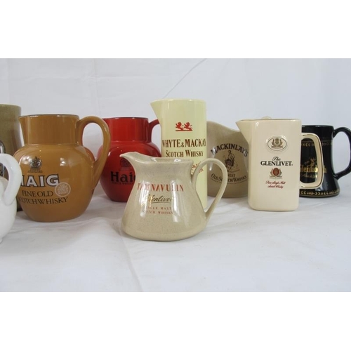 218 - Breweriana: Comprising eleven ceramic pub water jugs, advertising various whisky brands. (11).
Condi... 