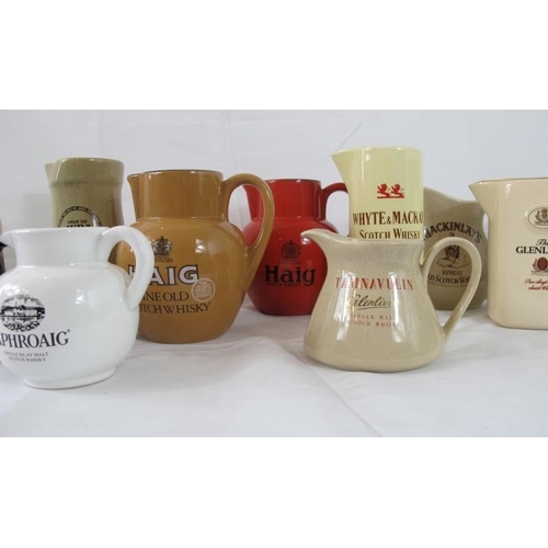 218 - Breweriana: Comprising eleven ceramic pub water jugs, advertising various whisky brands. (11).
Condi... 