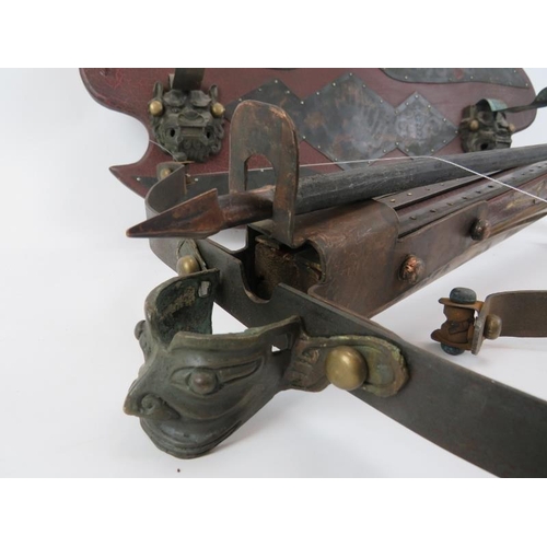 234 - A Oriental crossbow and wall mounted rack, 20th century. An additional limb included. Rack: 25.2 in ... 