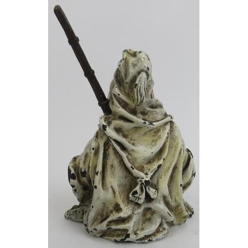 27 - An Austrian style cold painted bronze figure of an Arab with musket. Depicted seated on the ground w... 