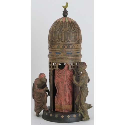 29 - A Bergman style cold painted bronze figural Arab group. Modelled depicting two Arabs outside a bathi... 