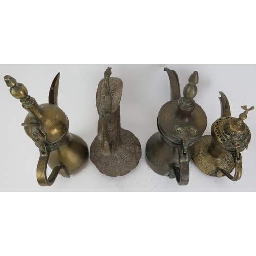 31 - A group of Middle Eastern Dallah's and a ewer, probably 19th century. (4 items) 11.9 in (30.3 cm) ta... 