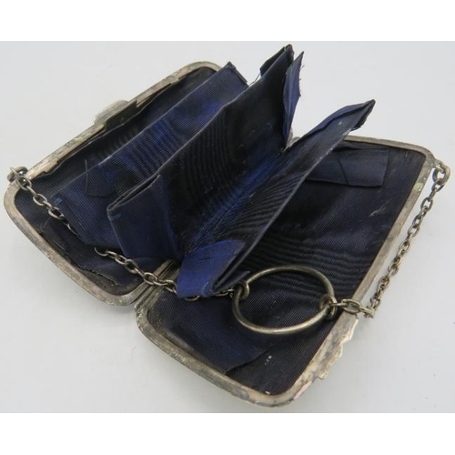 314 - A silver purse with original lining, Birmingham 1909, two silver napkin rings both fully hallmarked ... 