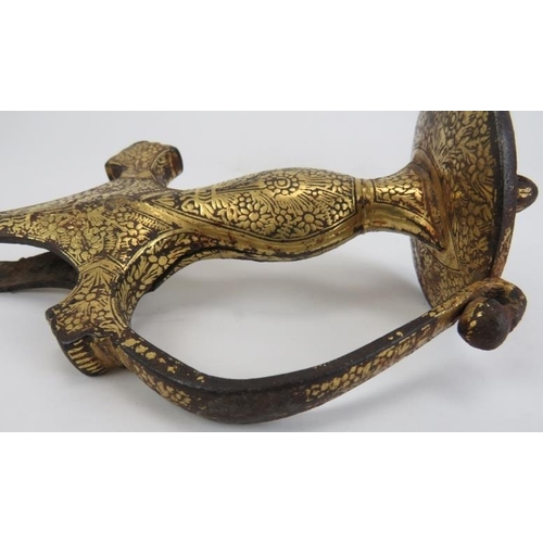 32 - A Mughal Indian gold damascened metal tulwar sword hilt, 17th century. Probably forged in iron with ... 