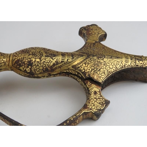 32 - A Mughal Indian gold damascened metal tulwar sword hilt, 17th century. Probably forged in iron with ... 