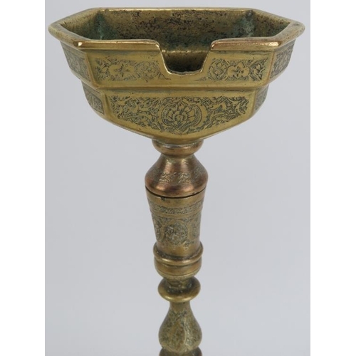 33 - A large Middle Eastern copper and brass astray on stand, late 19th/early 20th century. With finely e... 