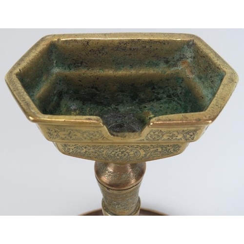 33 - A large Middle Eastern copper and brass astray on stand, late 19th/early 20th century. With finely e... 