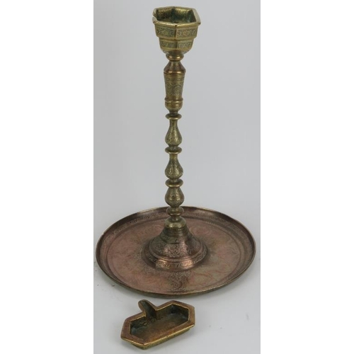 33 - A large Middle Eastern copper and brass astray on stand, late 19th/early 20th century. With finely e... 