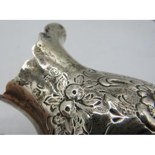 345 - A Victorian silver cream jug embossed with scrolls & flowers, a double scroll acanthus leaf handle &... 