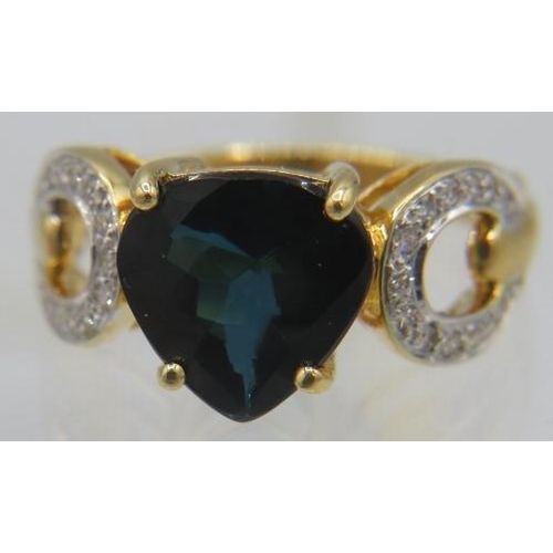 364 - An 18ct yellow gold ring set with a pear shaped checker board cut Mutuca indicolite, approx 3.12cts ... 