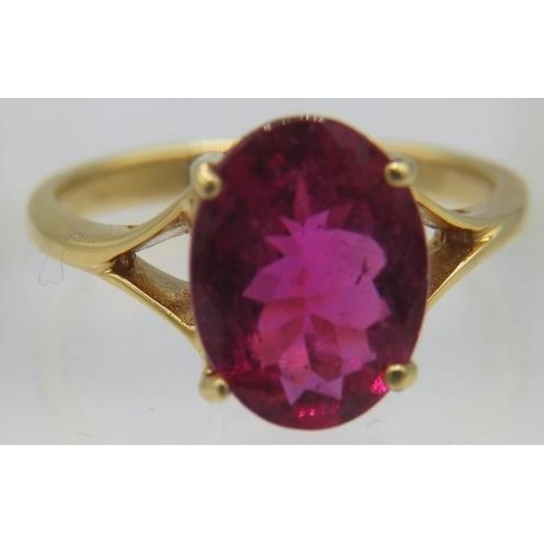 365 - An 18ct yellow gold ring set with an oval cut Shimoyo rubellite, approx 11mm x 8mm, approx weight 49... 