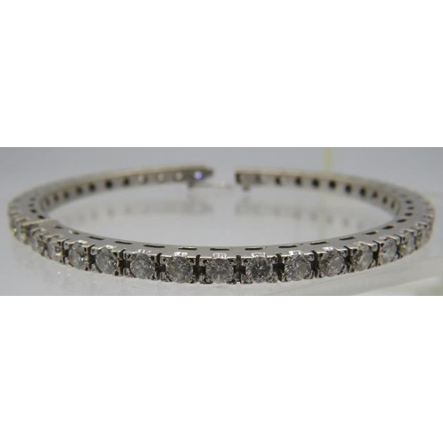 367 - A fine white metal bangle set with 43 diamonds, each approx 0.15cts, approx weight 28 grams.
NB: Ven... 