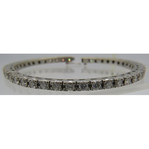 367 - A fine white metal bangle set with 43 diamonds, each approx 0.15cts, approx weight 28 grams.
NB: Ven... 