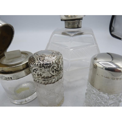 376 - A collection of three silver topped glass scent bottles with inner stoppers, all fully hallmarked an... 