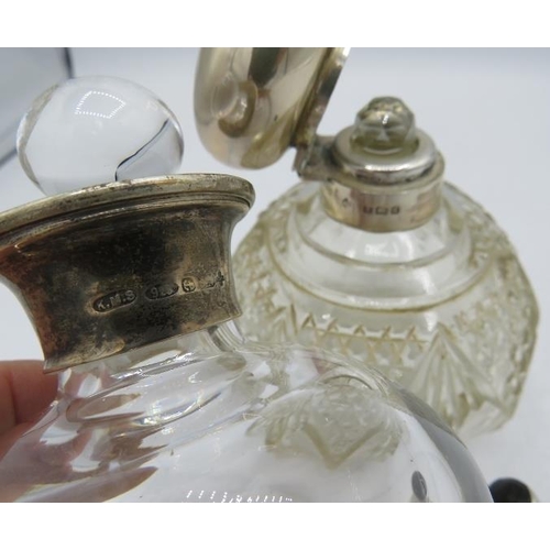 383 - A modern silver collared glass scent bottle, Birmingham 2000, a small Mexican 925 scent bottle and a... 