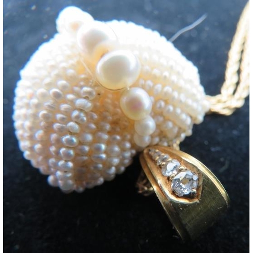 385 - A heart shaped vintage seed pearl pendant with row of larger graduated pearls down the centre. The b... 