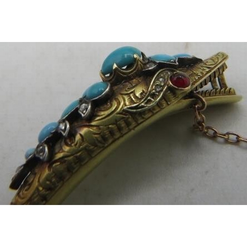 387 - A fine Victorian yellow metal bracelet of serpent biting it's tail. The head is embellished with tur... 