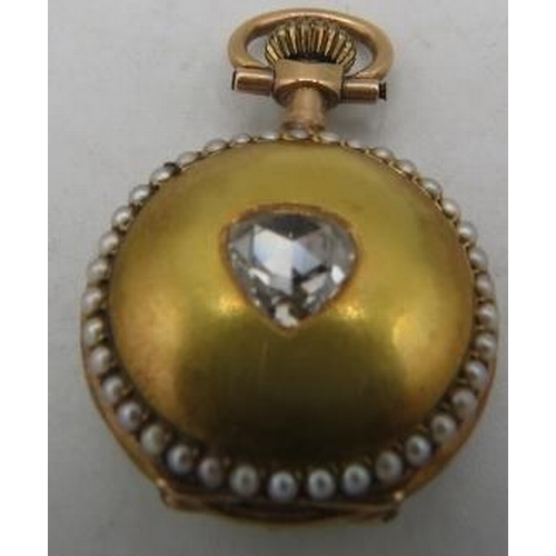 388 - A ladies (probably) yellow gold keyless lapel pendant watch set with seed pearls on the front and ba... 